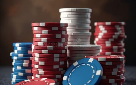Stacks of colorful poker chips arranged on a dark background